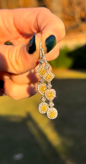 White gold latch back diamond earrings with princess cut, heart and oval yellow diamonds, princess cut white diamonds and round yellow and white diamonds natural