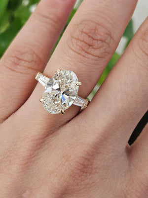5.0 CT Oval with 0.55 ct baguettes Yellow Engagement Ring