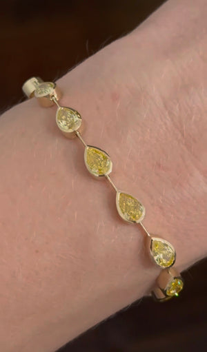 Yellow gold bezel set 10.93ct yellow pear shape lab diamond bracelet
