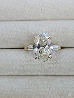 5.0 CT Oval with 0.55 ct baguettes Yellow Engagement Ring