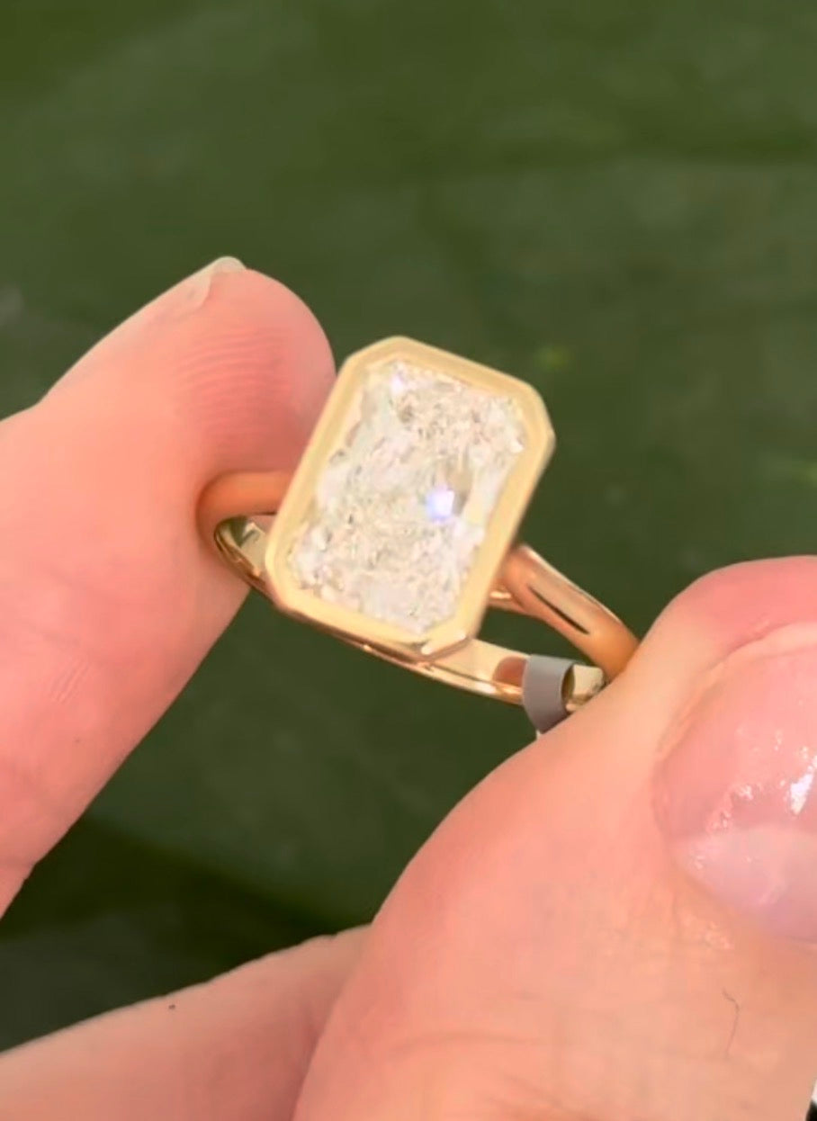 Yellow gold bezel set 2.99ct radiant lab diamond ring