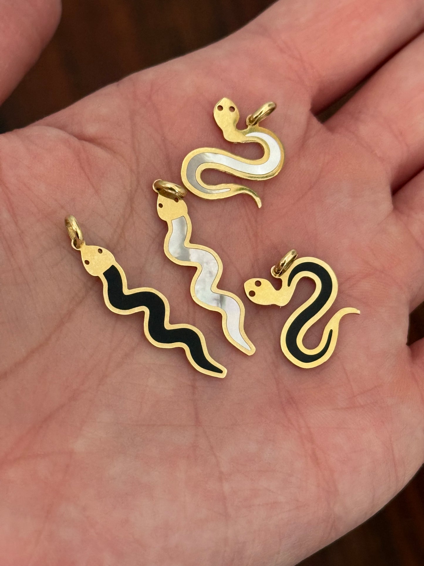 Yellow gold snake pendants