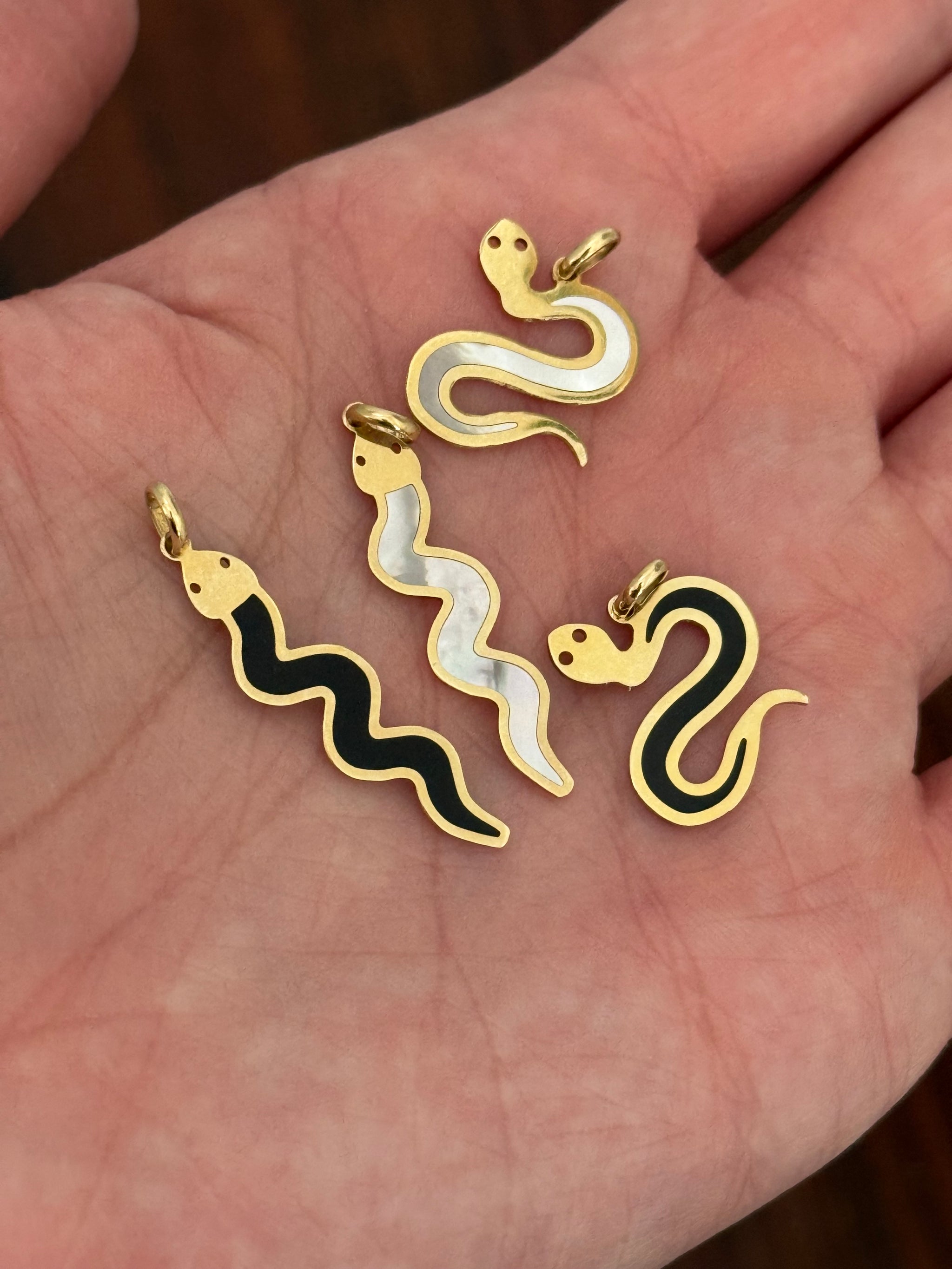 Yellow gold snake pendants