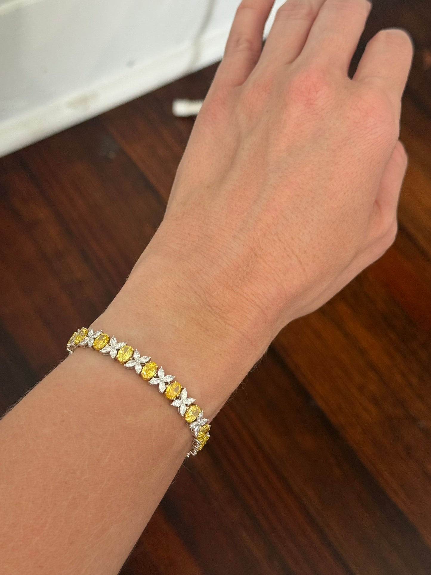 Yellow and white gold oval yellow lab diamond and marquise white lab diamond bracelet. Yellow lab diamonds are set in yellow gold and white lab diamonds are set in white gold.