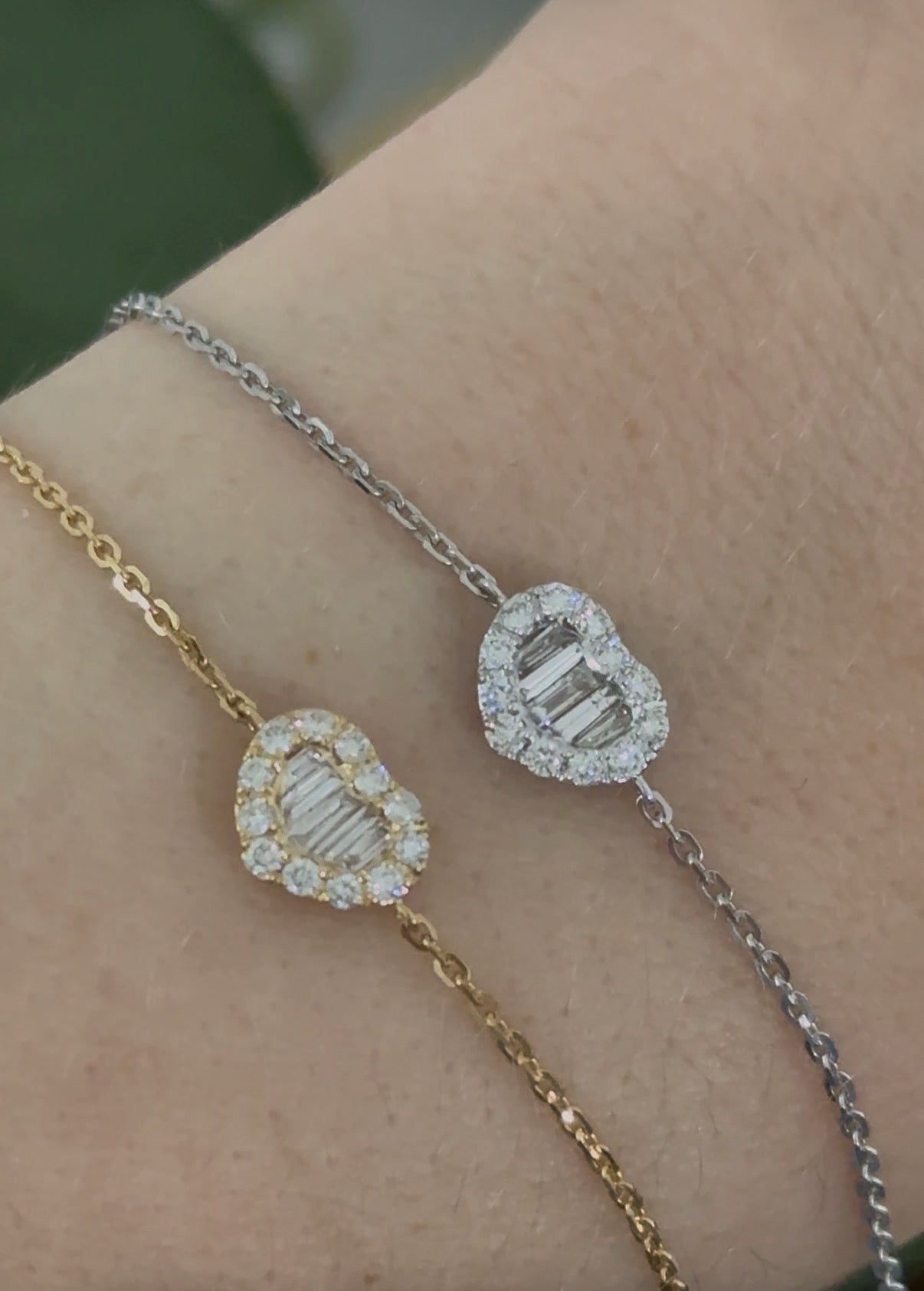 Heart chain bracelets with baguette and round diamonds available in yellow and white gold