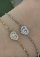 Heart chain bracelets with baguette and round diamonds available in yellow and white gold