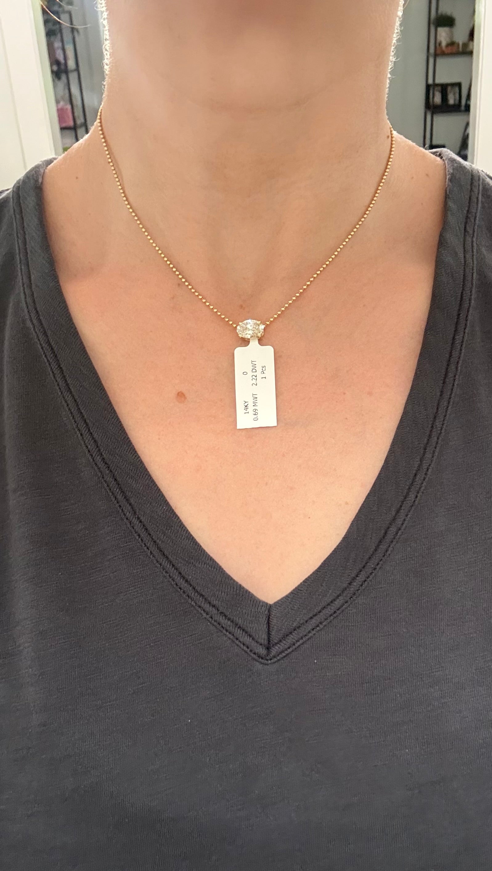 Yellow gold IGI certified 2.22ct oval lab diamond pendant. Can be worn east west and north south.