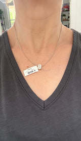 White gold IGI certified 4.1ct emerald cut lab diamond pendant. Can be worn east west and north south.