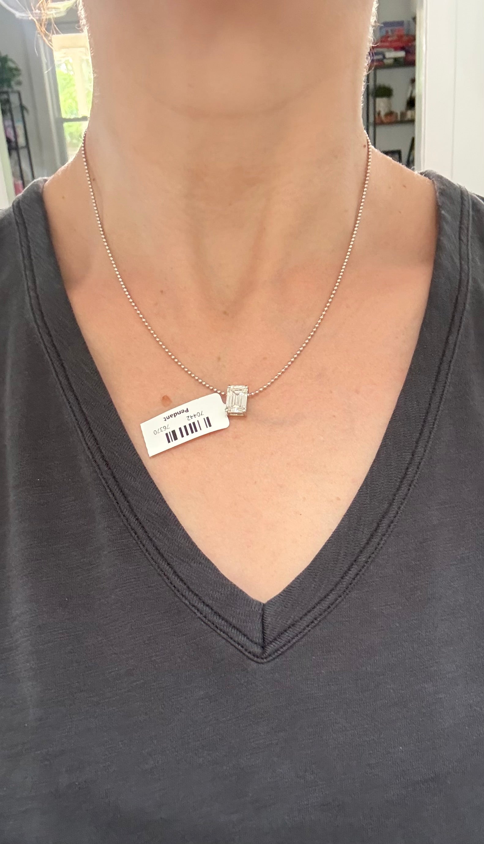 White gold IGI certified 4.1ct emerald cut lab diamond pendant. Can be worn east west and north south.