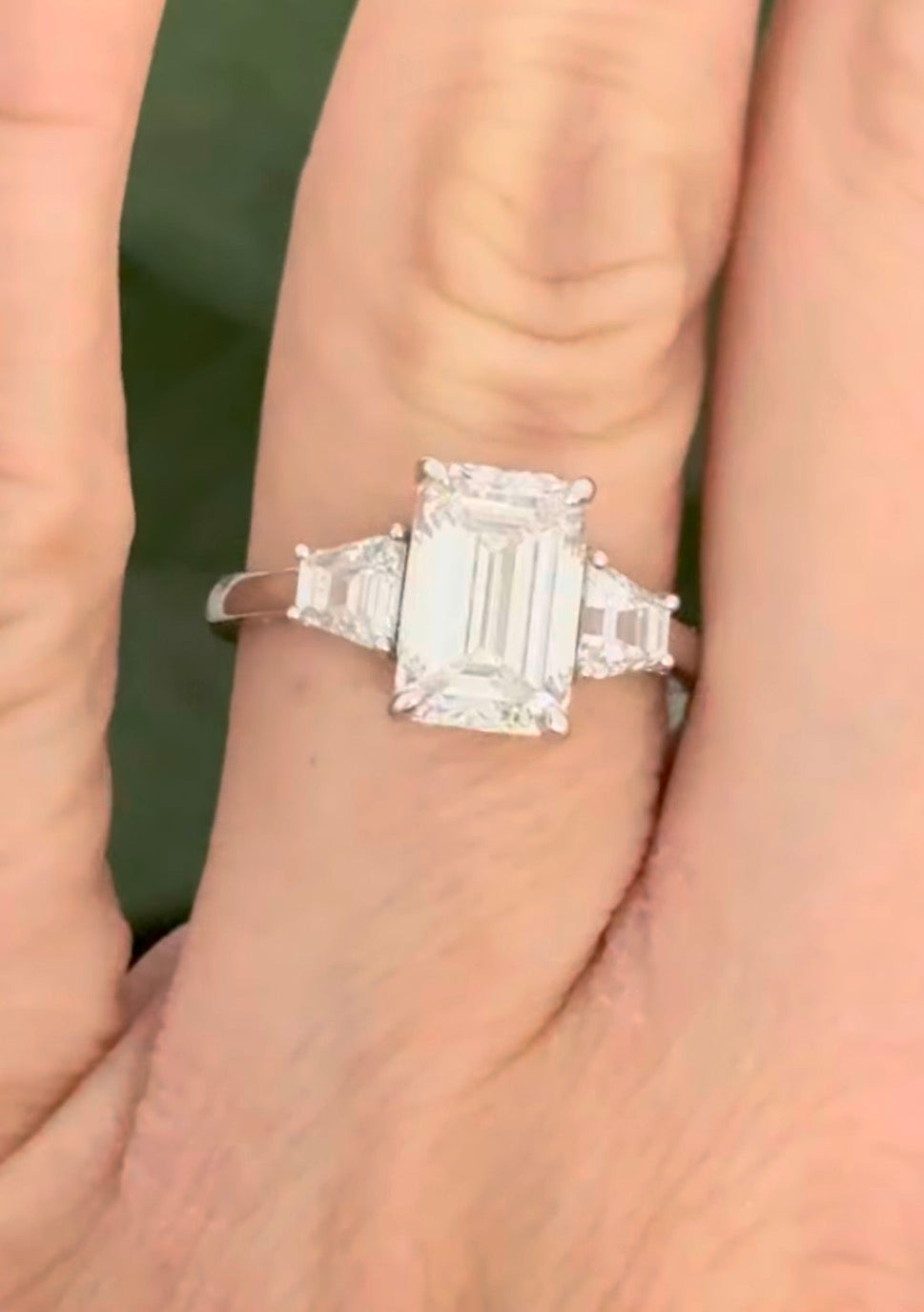 White gold IGI certified 3.04ct emerald cut lab diamond and trapezoid lab diamond ring. Emerald cut measures 10.12x6.70x4.46mm