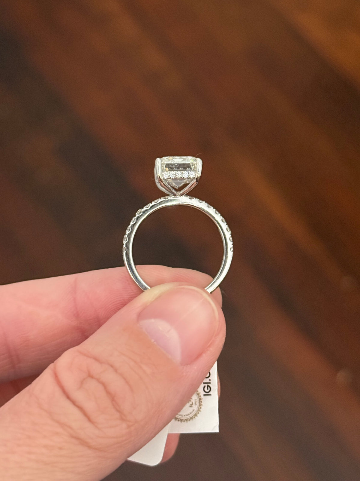 IGI certified emerald cut and round lab diamond ring. Center stone is 5.06cts
