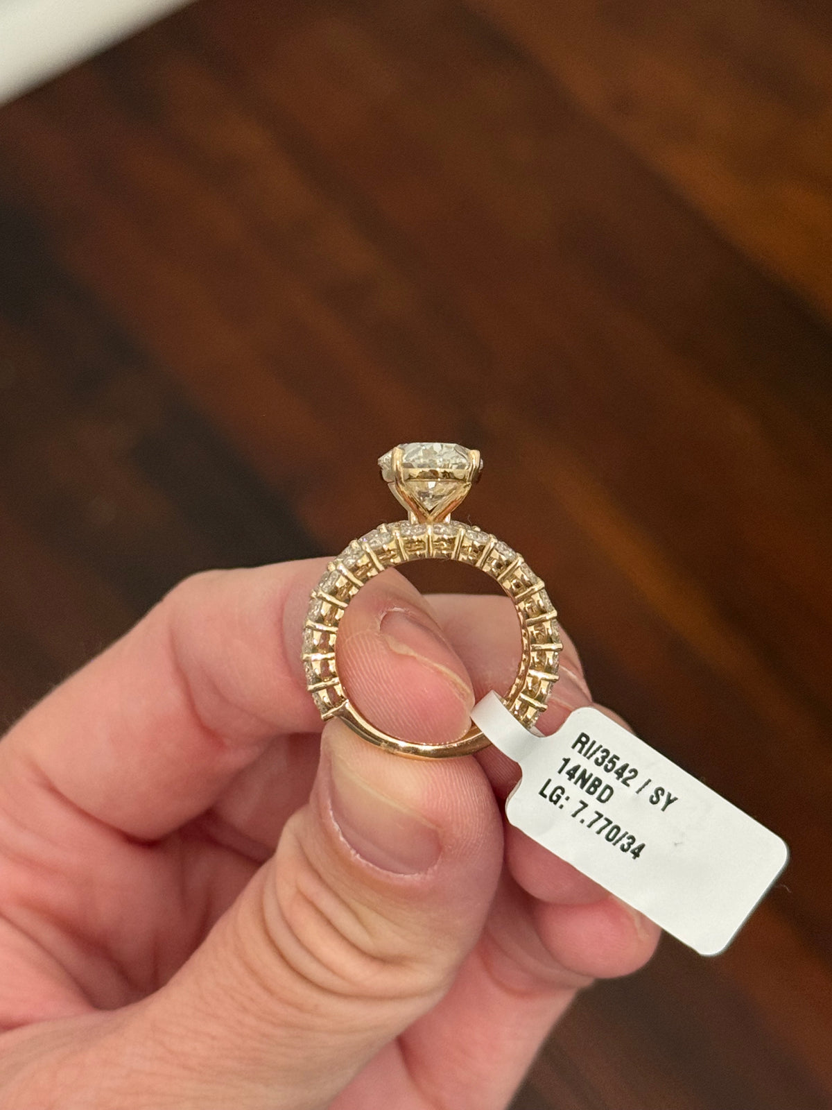 Yellow gold oval and round lab diamond ring and band set. Center stone is 5.1cts