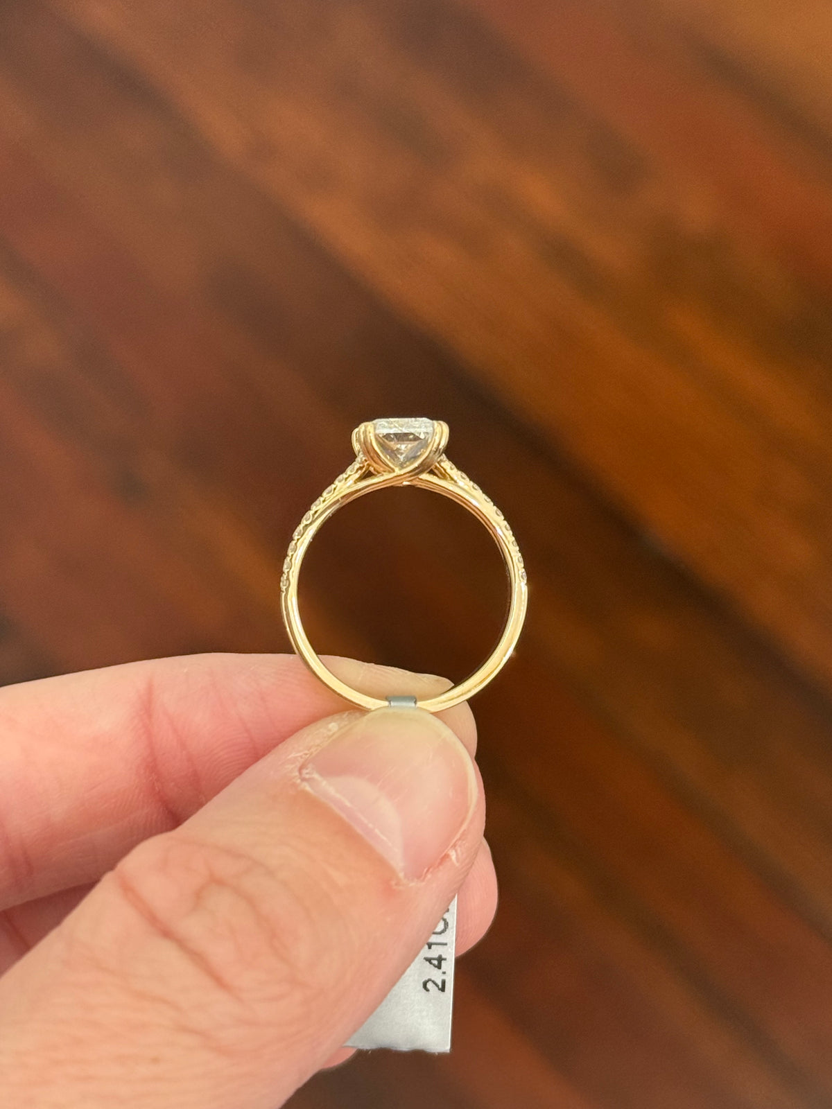 Yellow gold radiant and round lab diamond ring