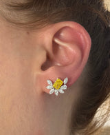 White gold radiant yellow lab diamond and pear shape and marquise white lab diamond earrings. Yellow lab diamond is set in yellow gold.