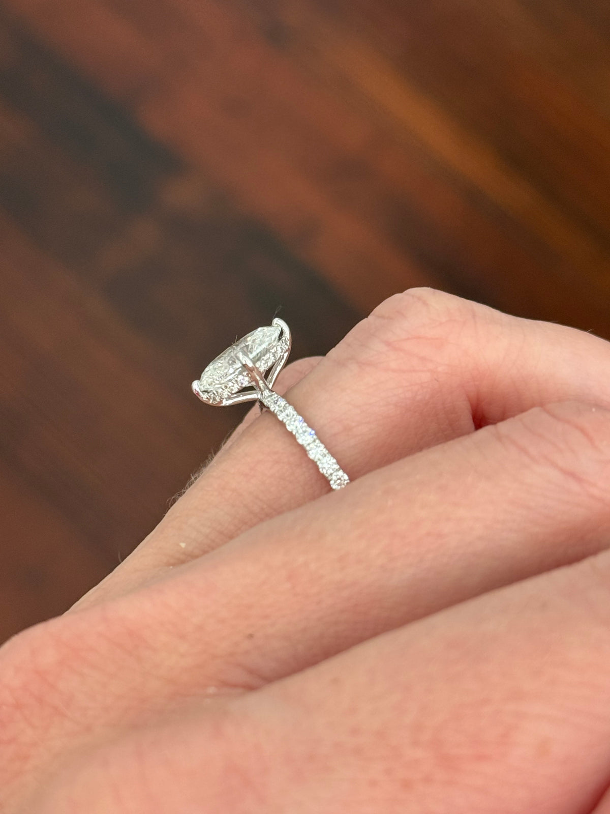 IGI certified white gold oval and round lab diamond ring