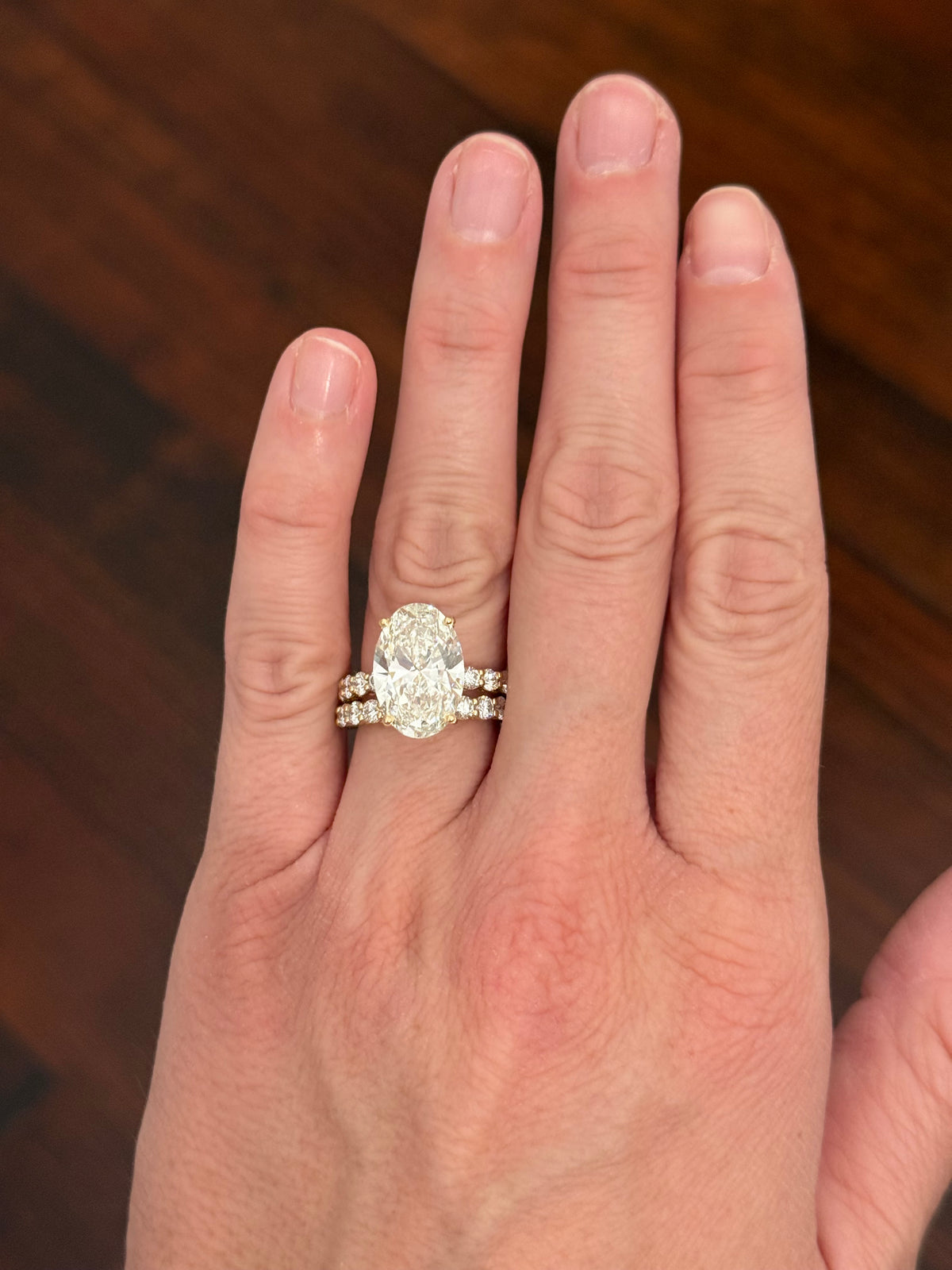 Yellow gold oval and round lab diamond ring and band set. Center stone is 6.58cts