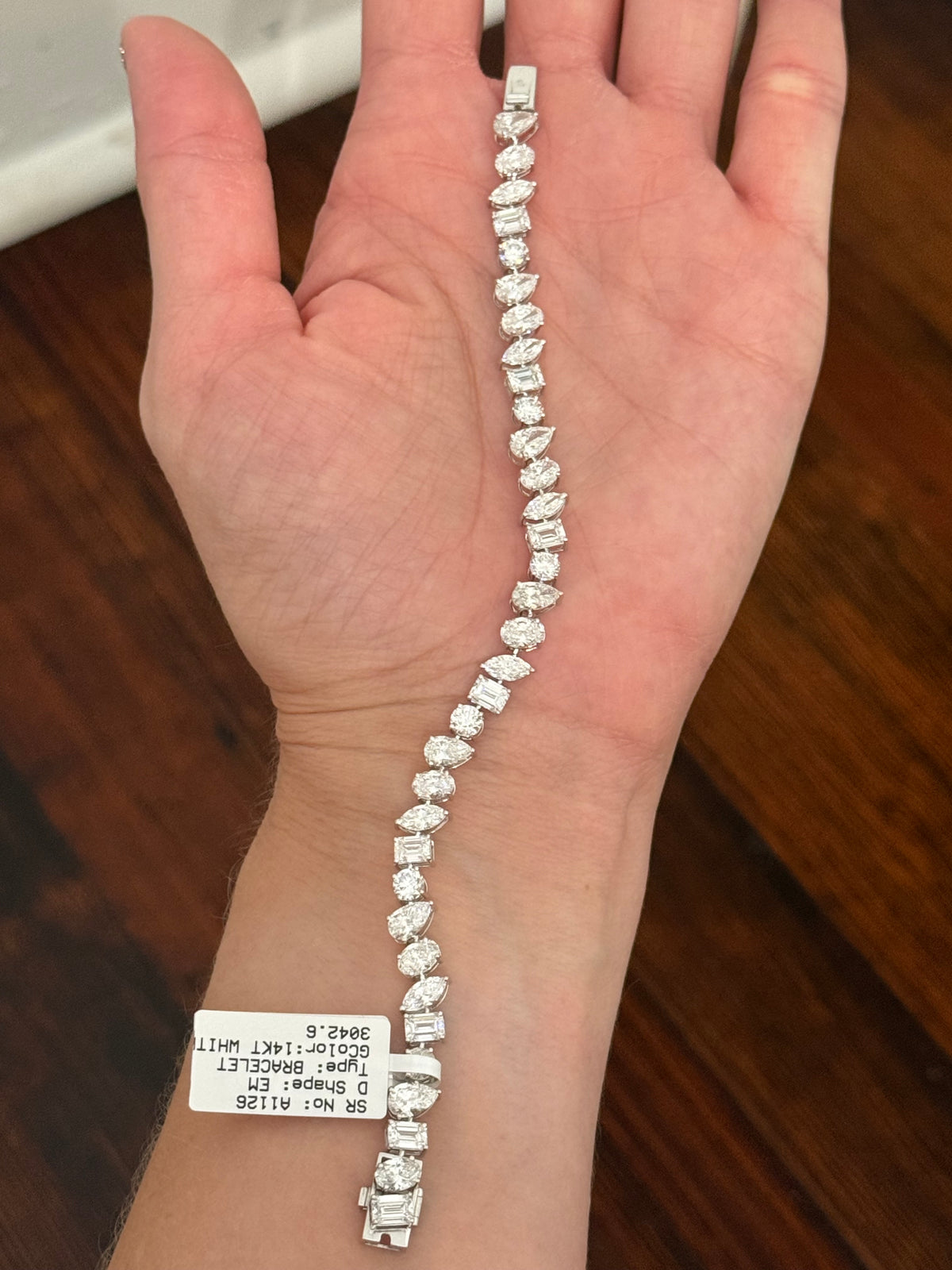 White gold mixed shape bracelet with 15.57cts of pear shape, oval, marquise, emerald cut and round lab diamonds