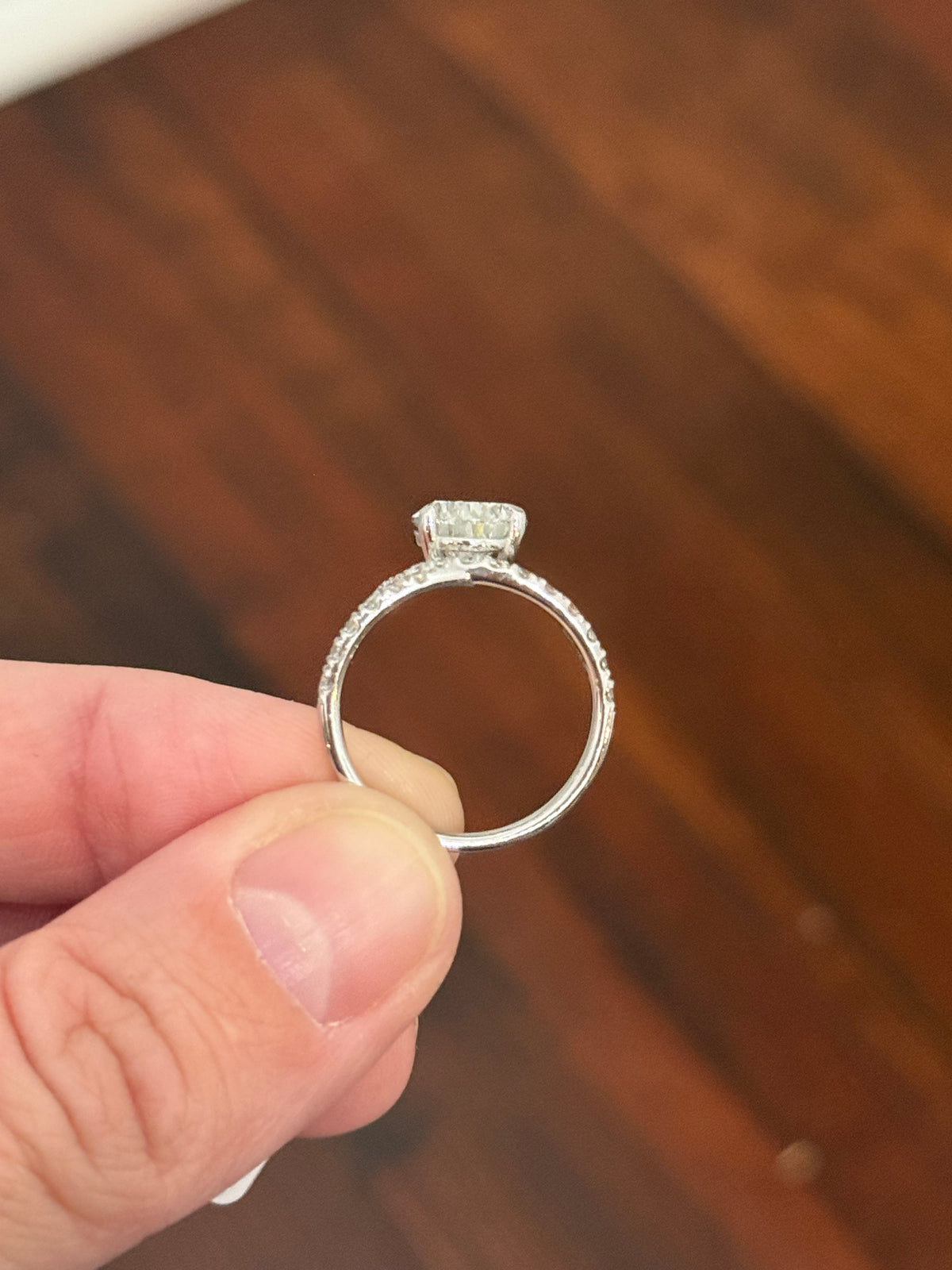 White gold pear shape and round lab diamond ring. Center stone is 3.08cts
