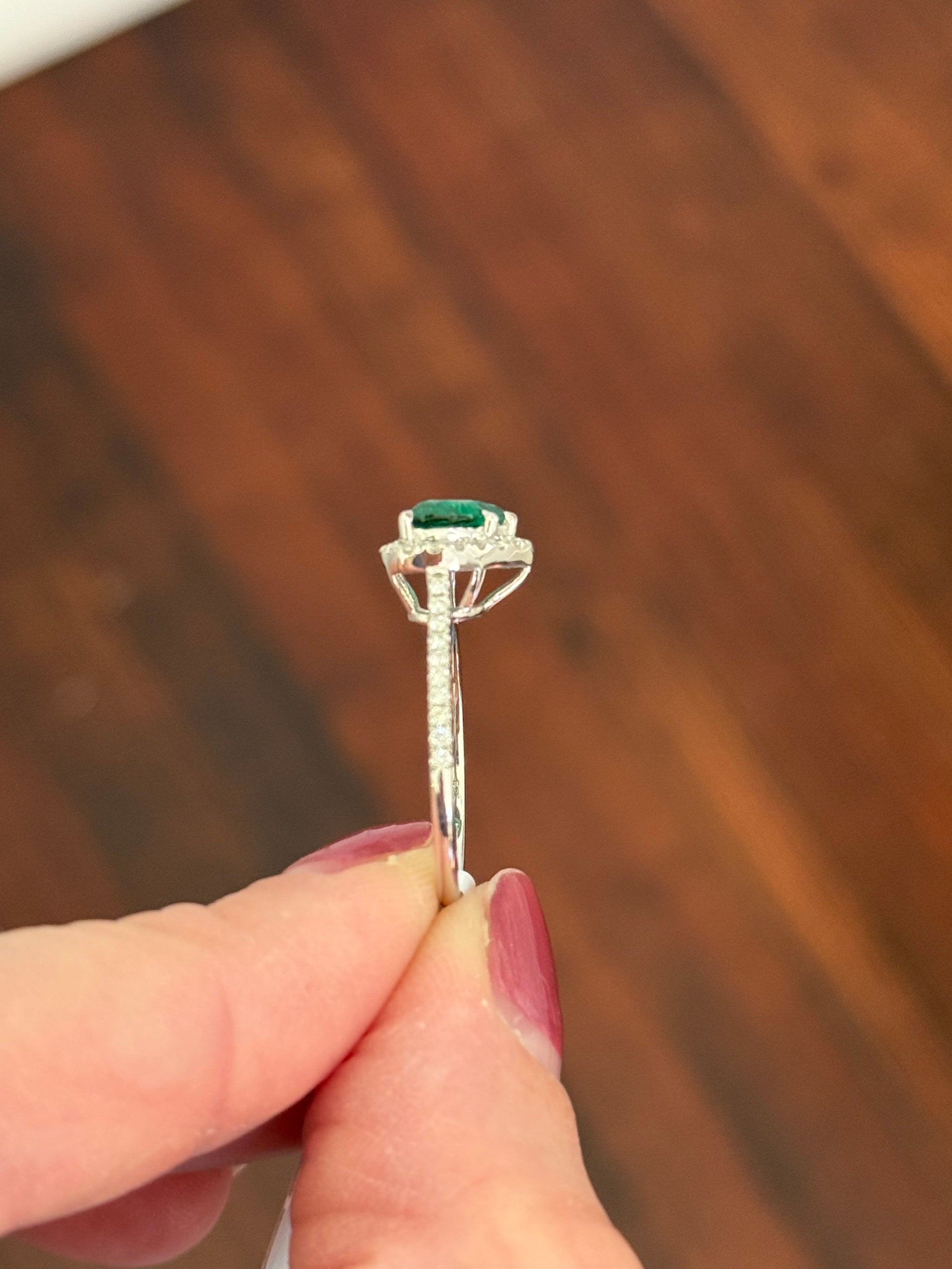 White gold heart shaped lab emerald and round lab diamond ring