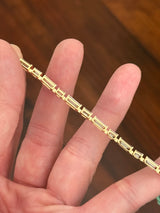 Yellow gold 7.22ct baguette and emerald cut natural diamond bracelet
