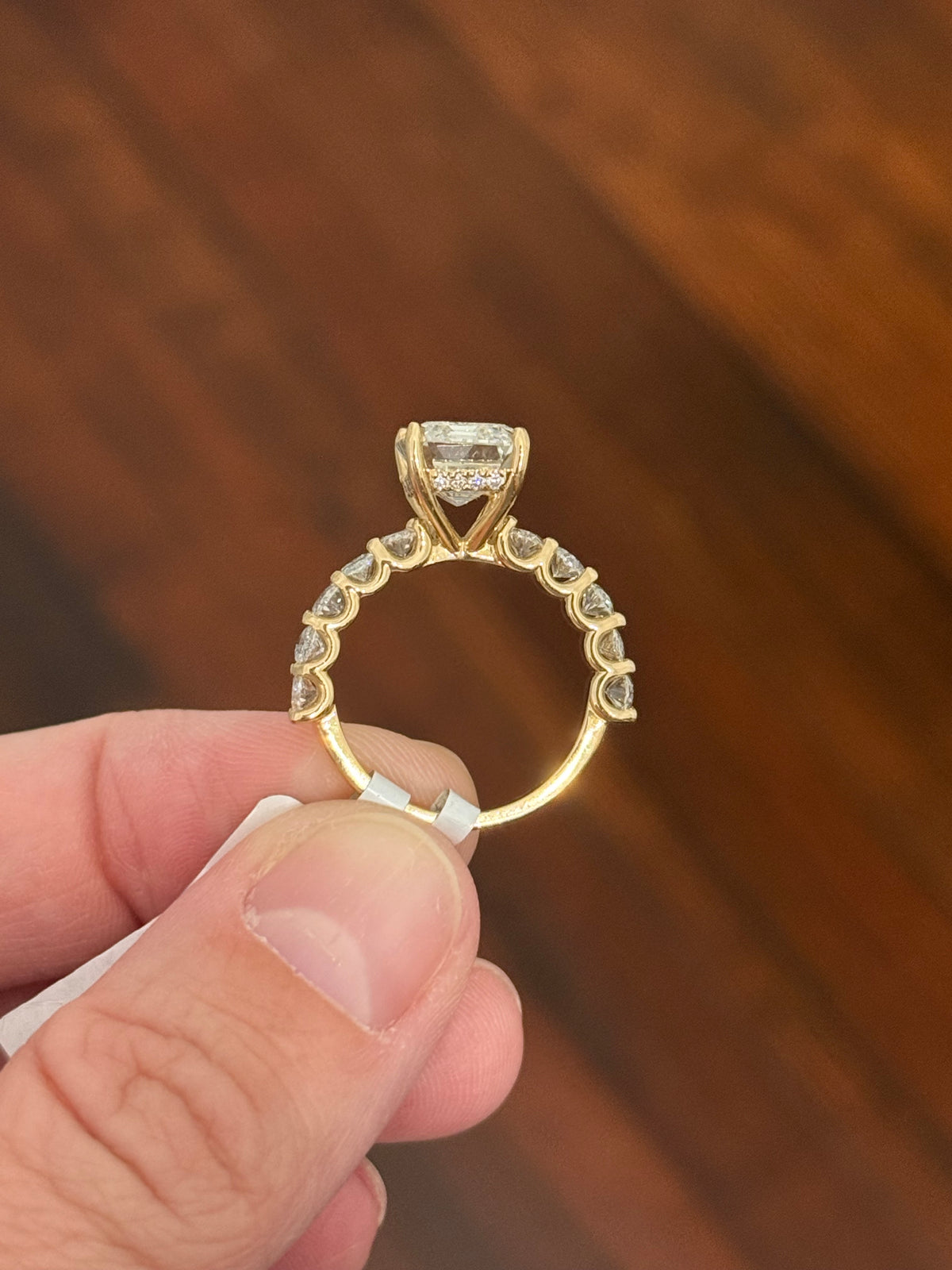 IGI certified emerald cut and oval and round lab diamond ring. Center stone is 5.05cts