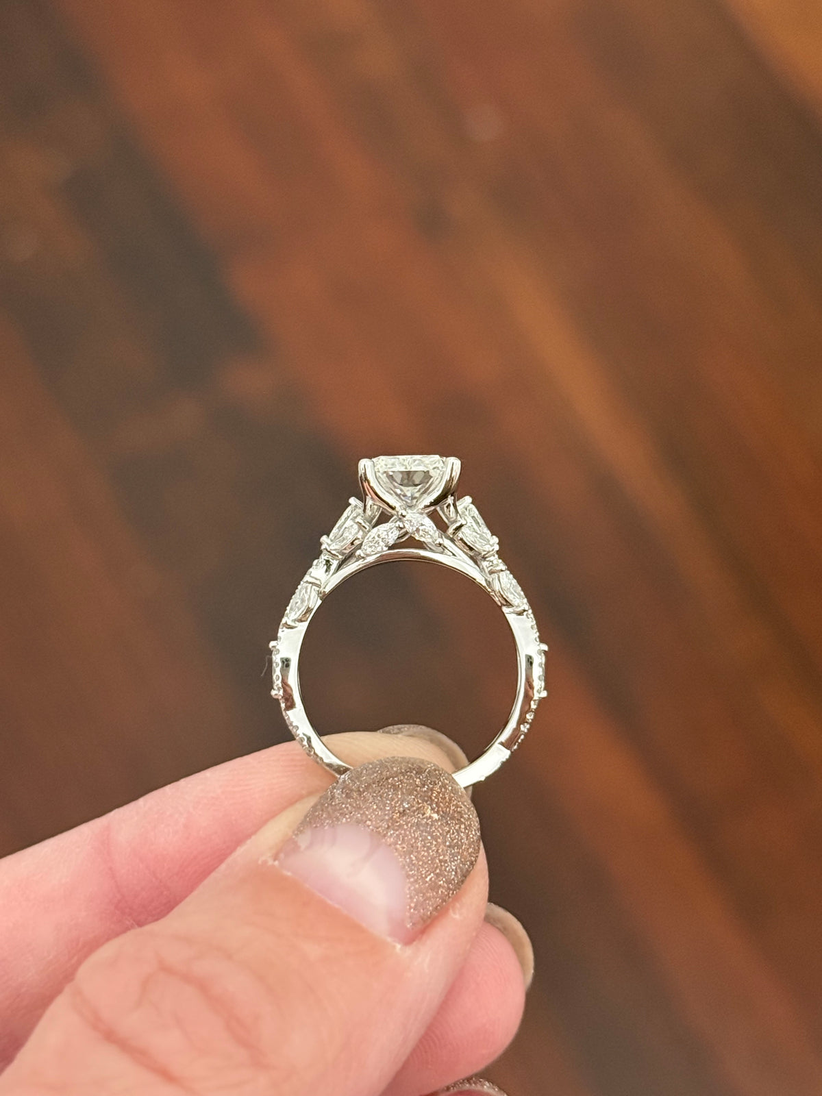 White gold radiant, marquise and round lab diamond ring. Center stone is 3.06cts E VS1 and measures 9.7x6.6mm