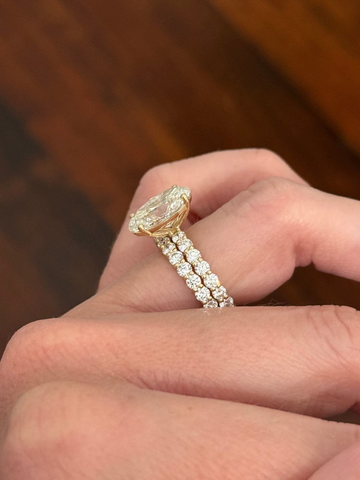 Yellow gold oval and round lab diamond ring and band set. Center stone is 5.1cts