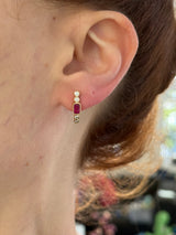 Natural diamond screw back earrings available in yellow gold with rubies and white gold with sapphires