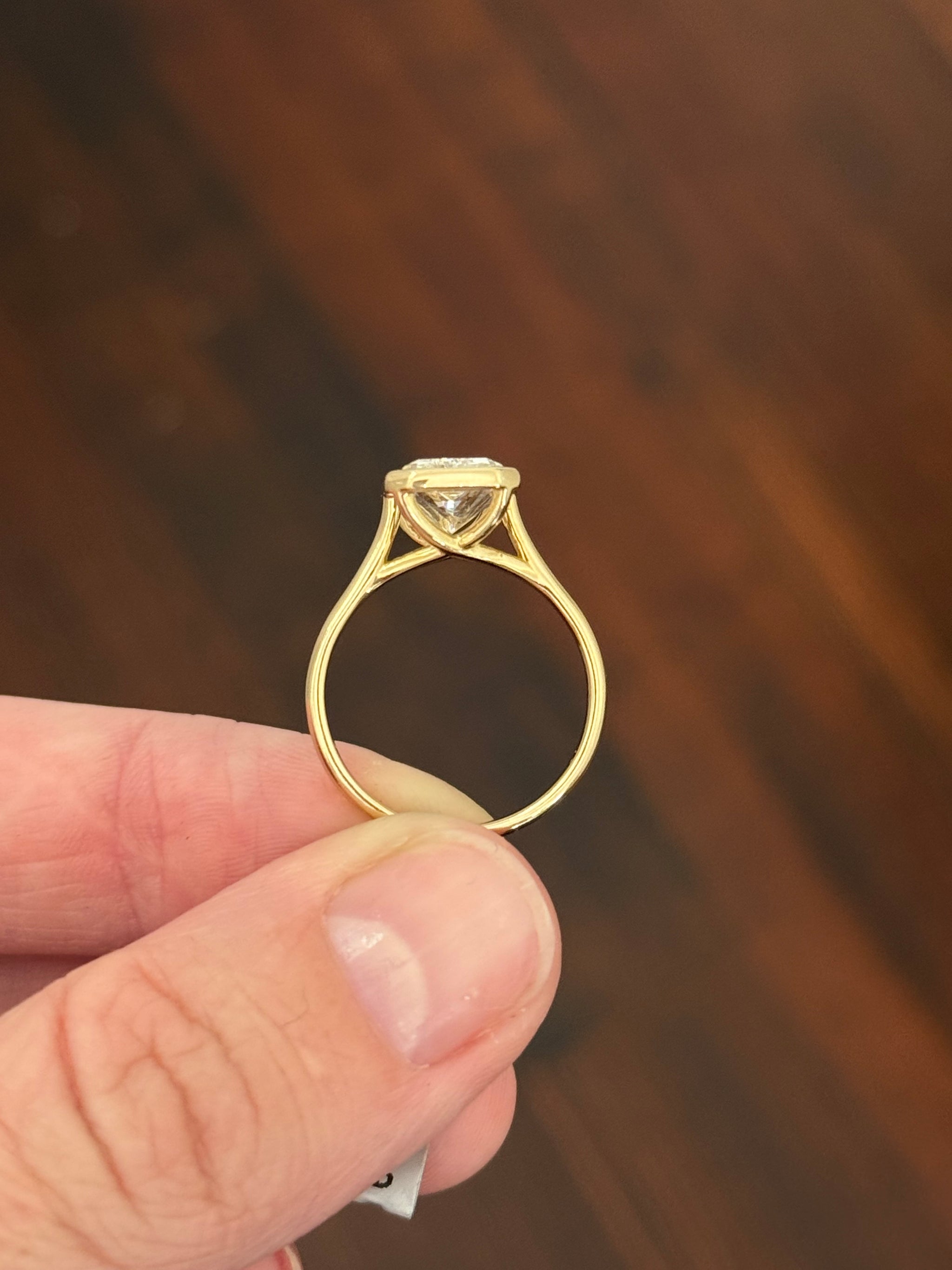 Yellow gold bezel set 2.99ct radiant lab diamond ring