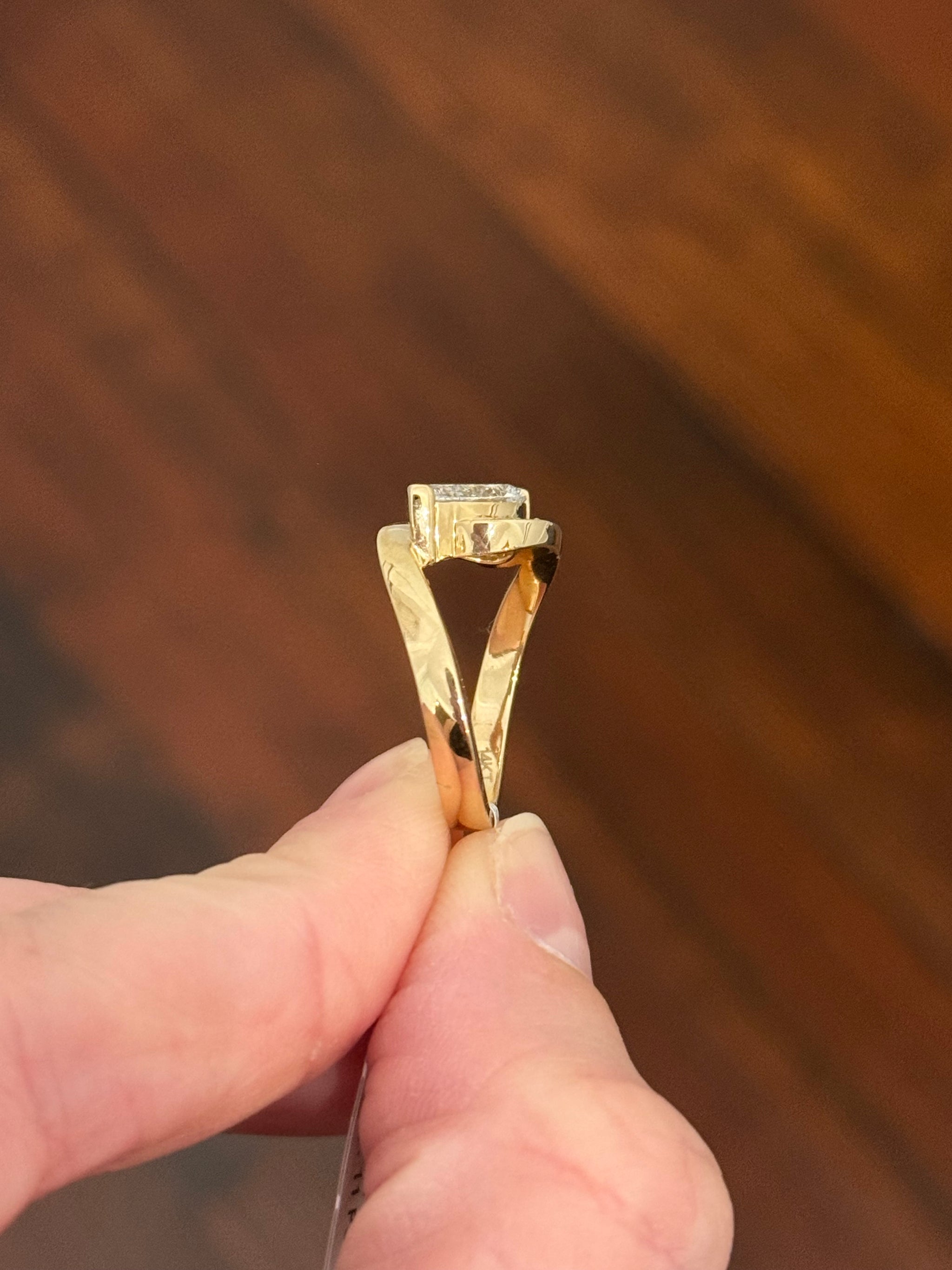 Yellow gold pear shape and round lab diamond ring. Pear shape is IGI certified and 1.54cts E VS1