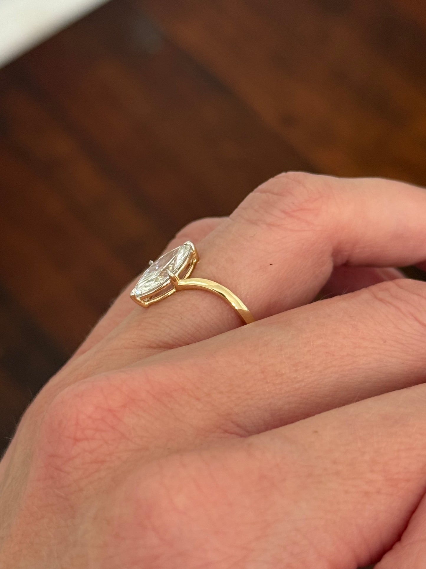 Yellow gold 1.49ct marquise lab diamond ring. Prongs are white gold.