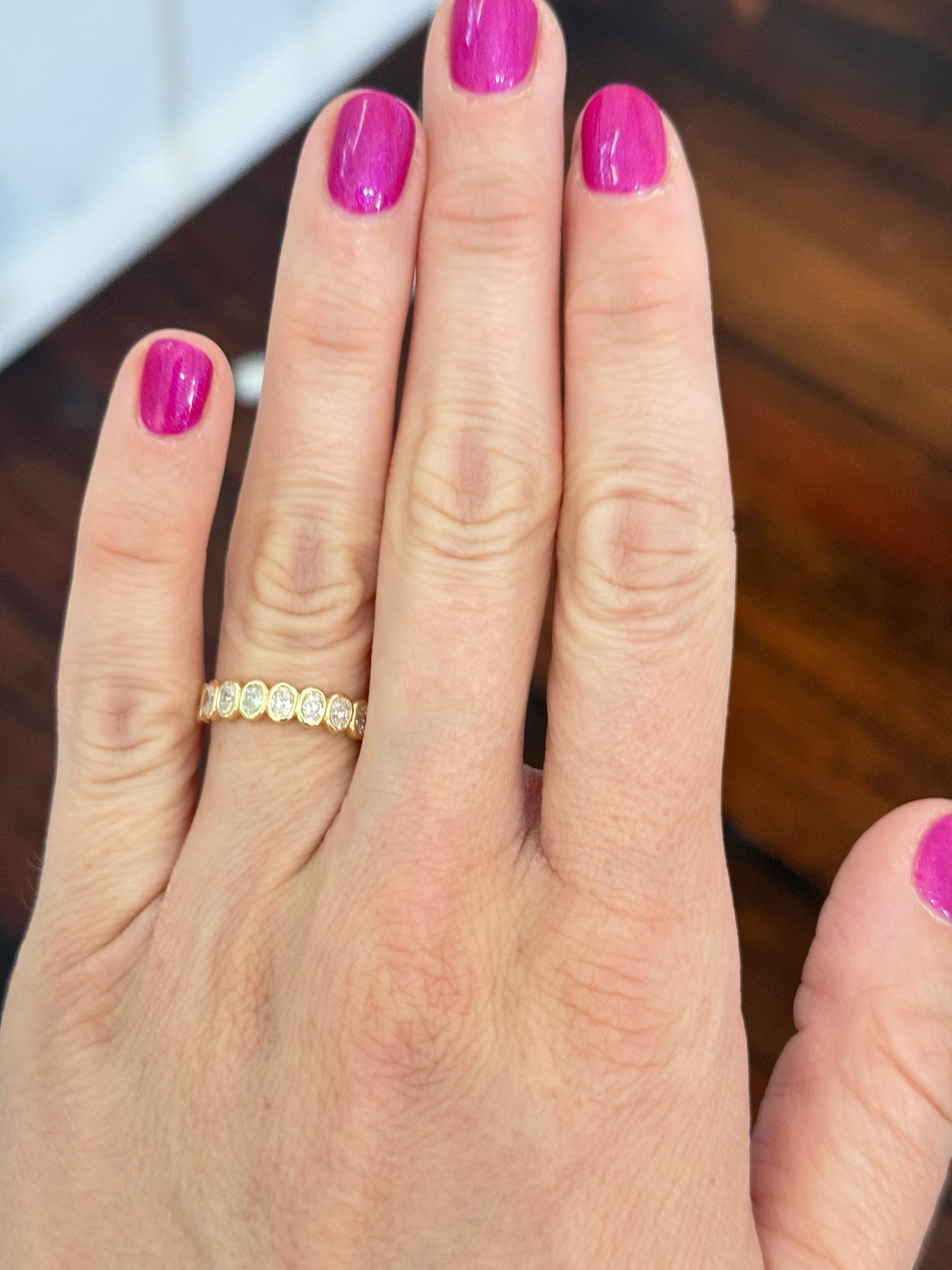 Yellow gold bezel set oval lab diamond band