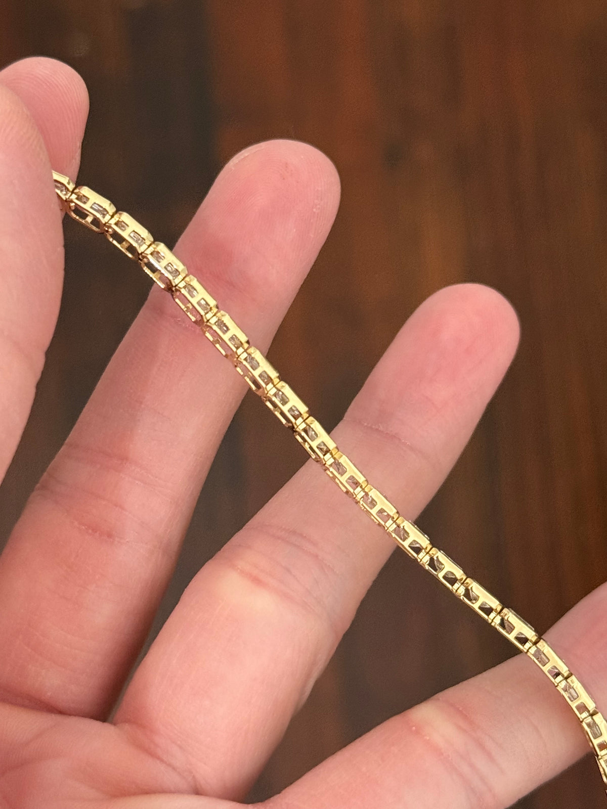 Yellow gold east west and bezel set 8.17ct emerald cut lab diamond bracelet