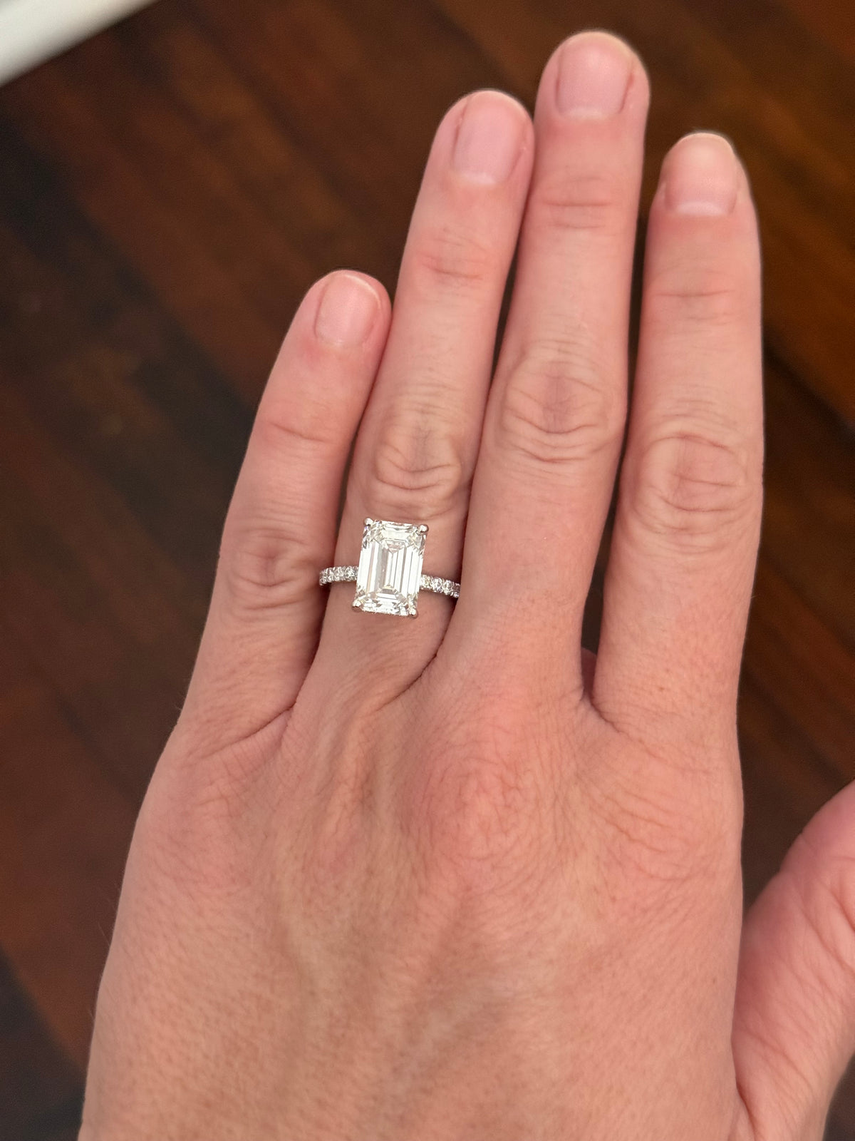 IGI certified emerald cut and round lab diamond ring. Center stone is 5.06cts