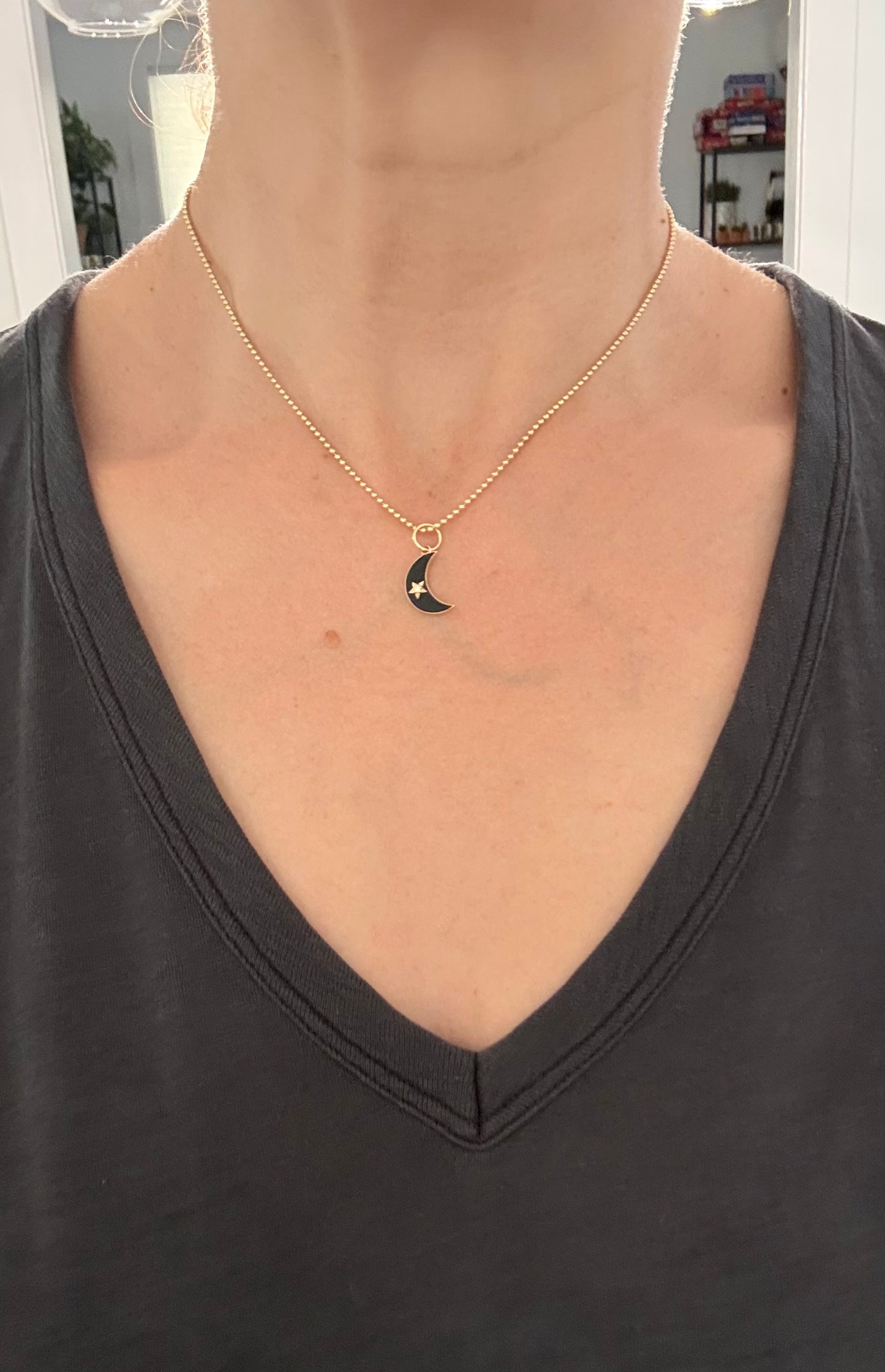 Yellow gold natural diamond and black enamel crescent pendant