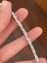White gold 5.91ct tapered baguette blue and white lab diamond bracelet