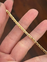 Yellow gold bezel and east west set 4.5ct emerald and princess cut natural diamond bracelet