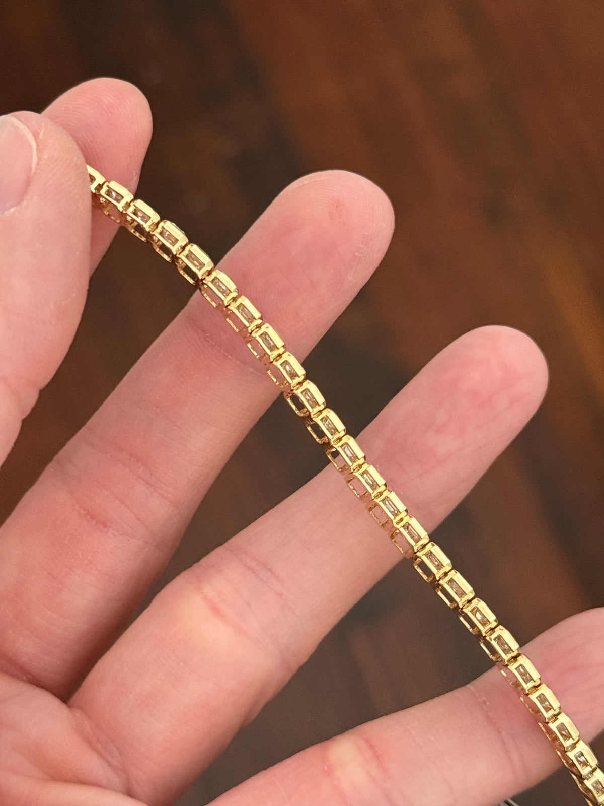 Yellow gold bezel set 10.07ct emerald cut lab diamond bracelet