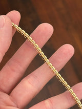 Yellow gold bezel set 10.07ct emerald cut lab diamond bracelet