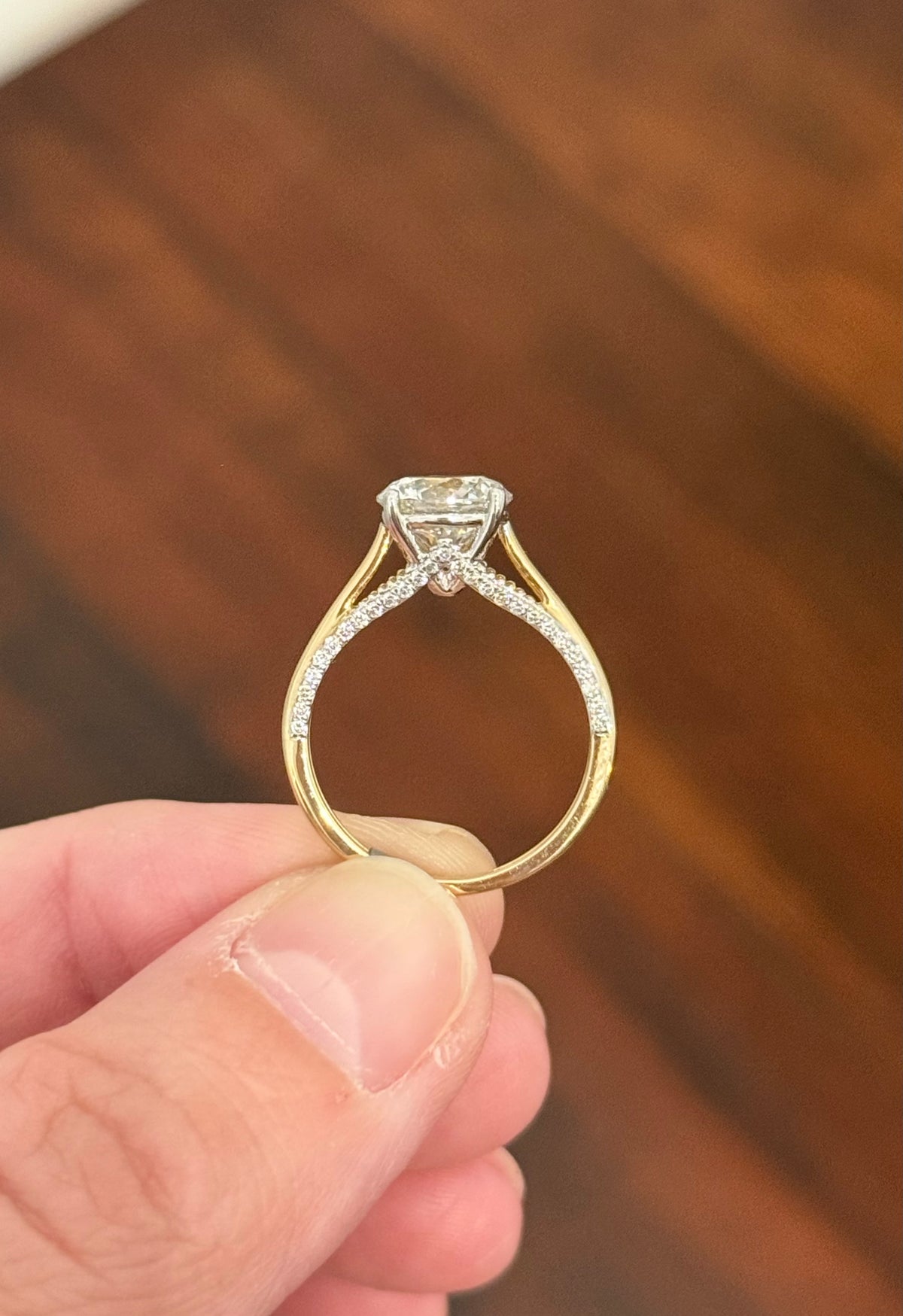 Yellow gold lab diamond ring. Lab diamonds are set in white gold.