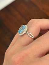White gold oval blue lab diamond and white lab diamond ring