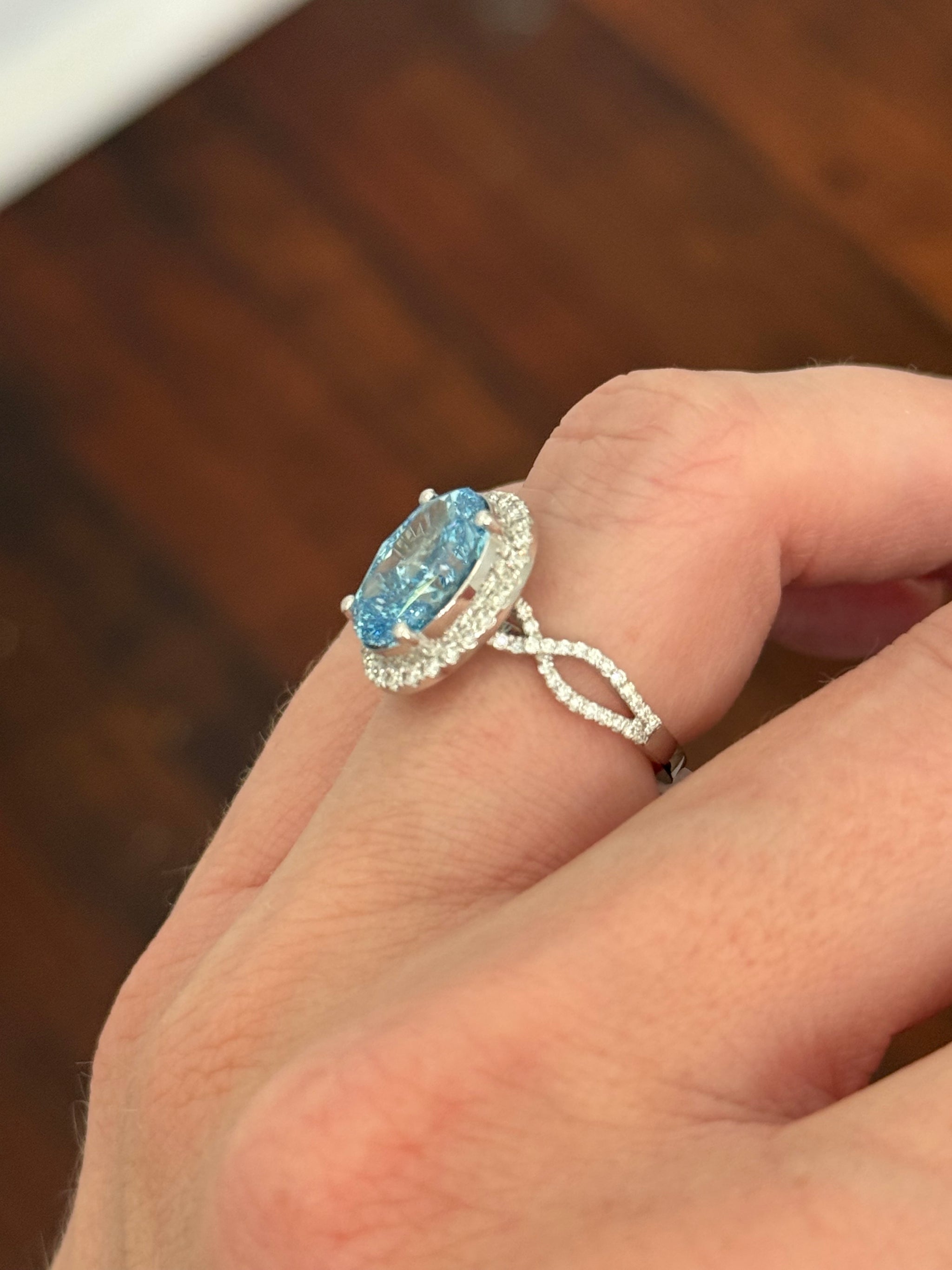 White gold oval blue lab diamond and white lab diamond ring