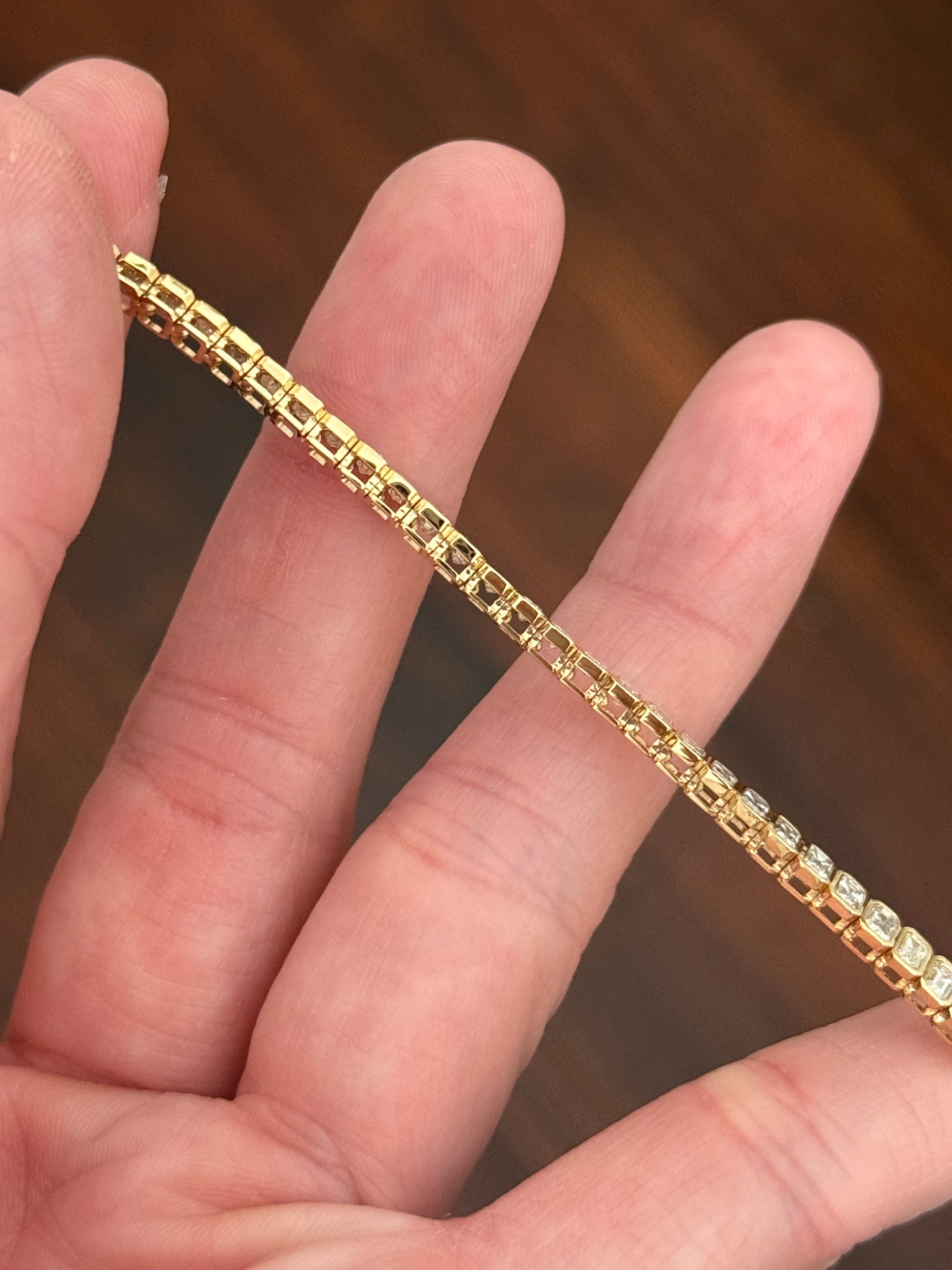 Yellow gold bezel set 5.15ct emerald cut natural diamond bracelet