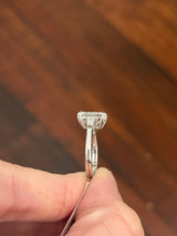 White gold IGI certified emerald cut and tapered baguette lab diamond ring. Center stone is 3.06cts