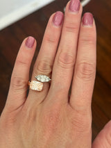 Rose and white gold cushion pink lab diamond and white marquise lab diamond toi et moi ring. Pink lab diamond is set in rose gold and white lab diamond is set in white gold.