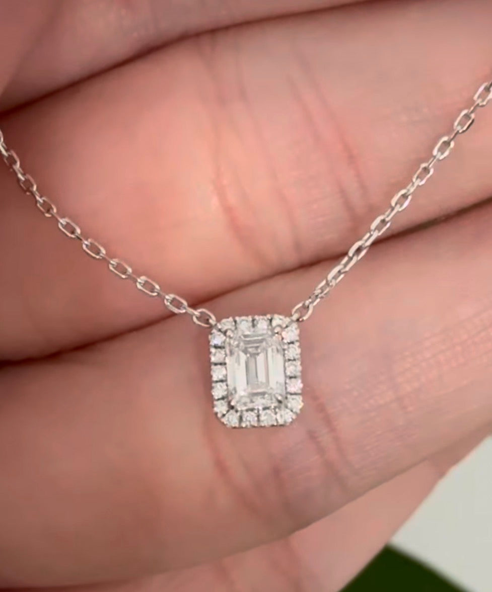 White gold emerald cut lab diamond necklace. Center stone is 0.50cts and measures 5.2x3.7mm. Chain is 16” with an adjustment of 4” to make as long as 20”.