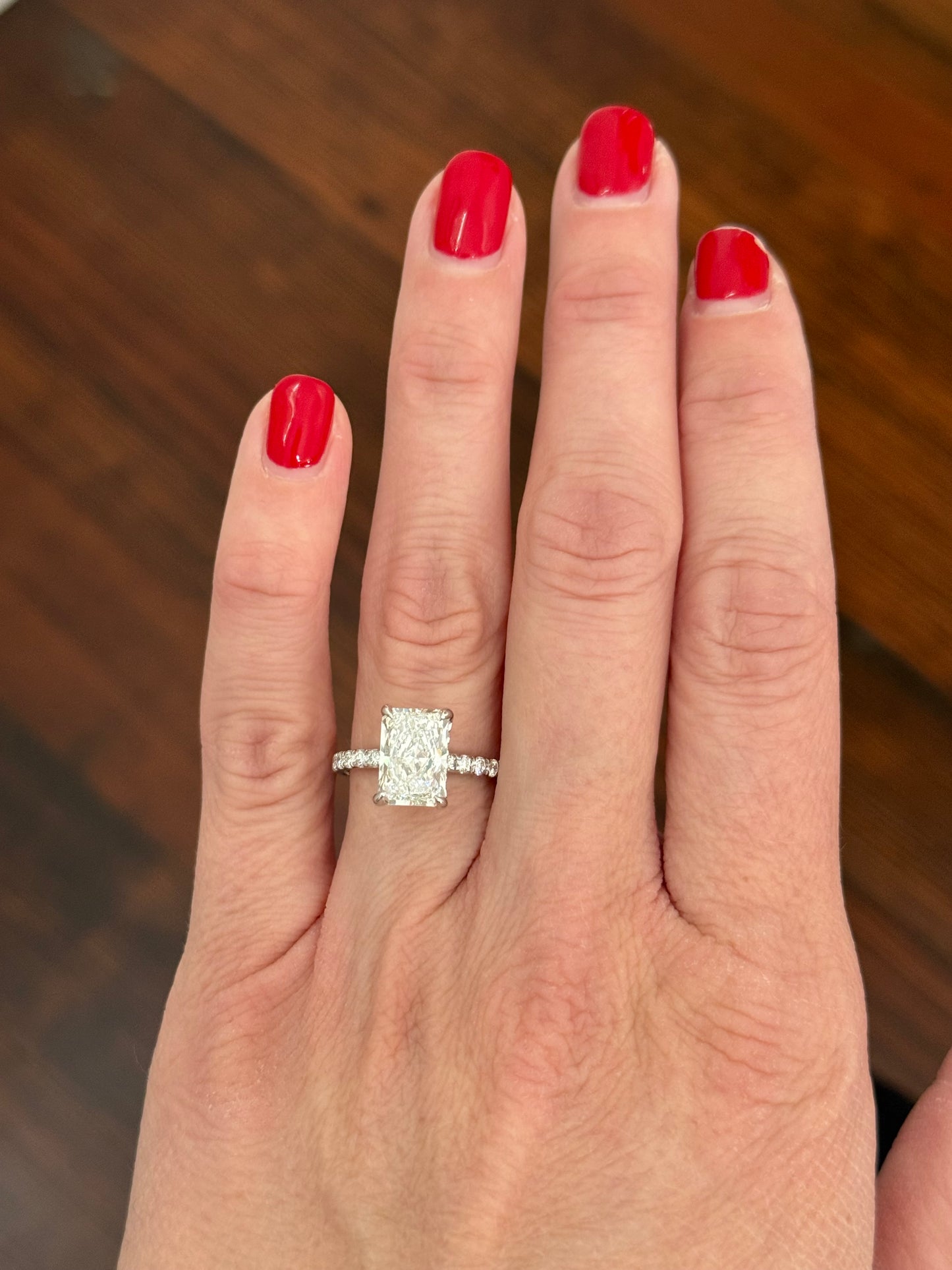 White gold radiant lab diamond ring. Center stone is IGI certified and 3.0cts E VVS2