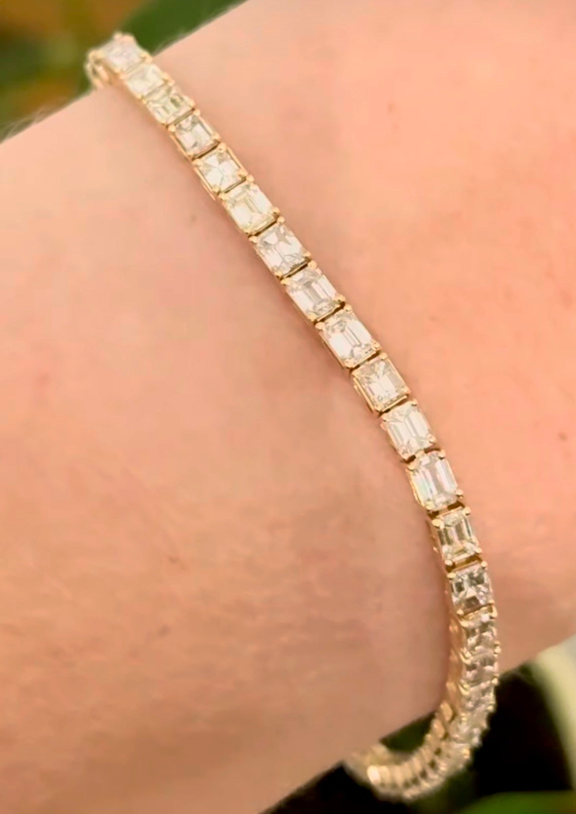 Yellow gold east west set 6.88ct emerald cut natural diamond bracelet