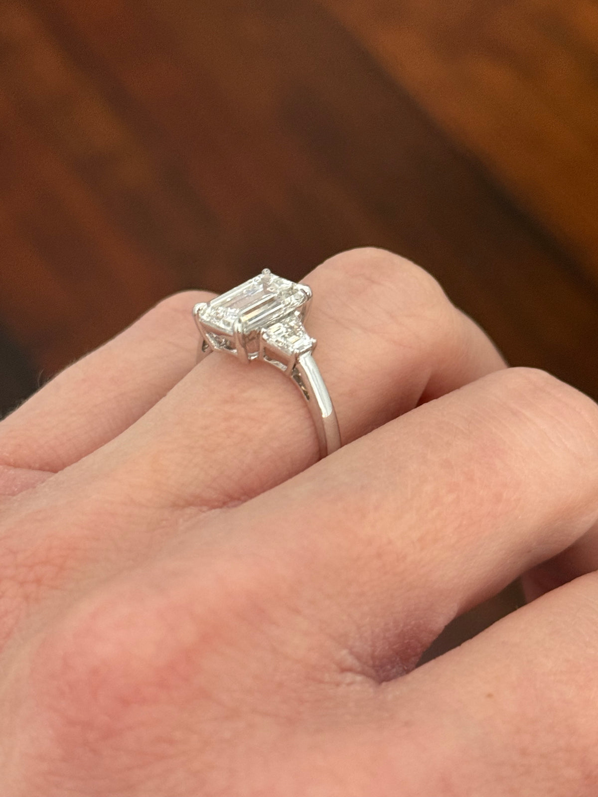 White gold IGI certified 3.04ct emerald cut lab diamond and trapezoid lab diamond ring. Emerald cut measures 10.12x6.70x4.46mm
