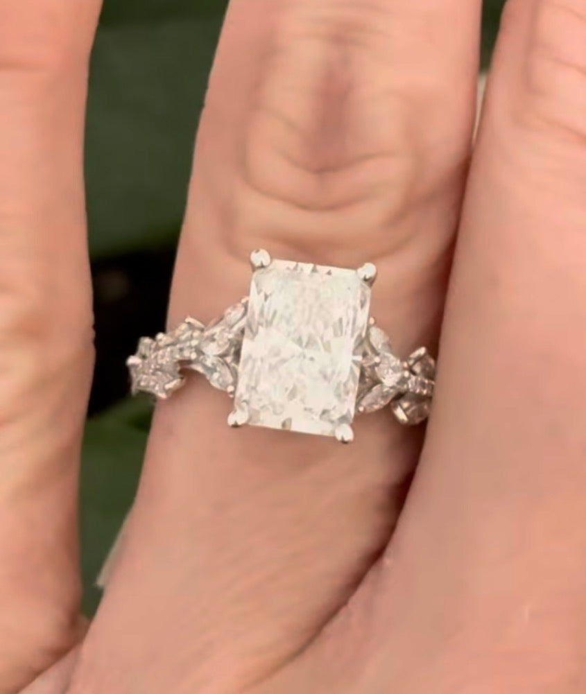 White gold radiant, marquise and round lab diamond ring. Center stone is 3.06cts E VS1 and measures 9.7x6.6mm